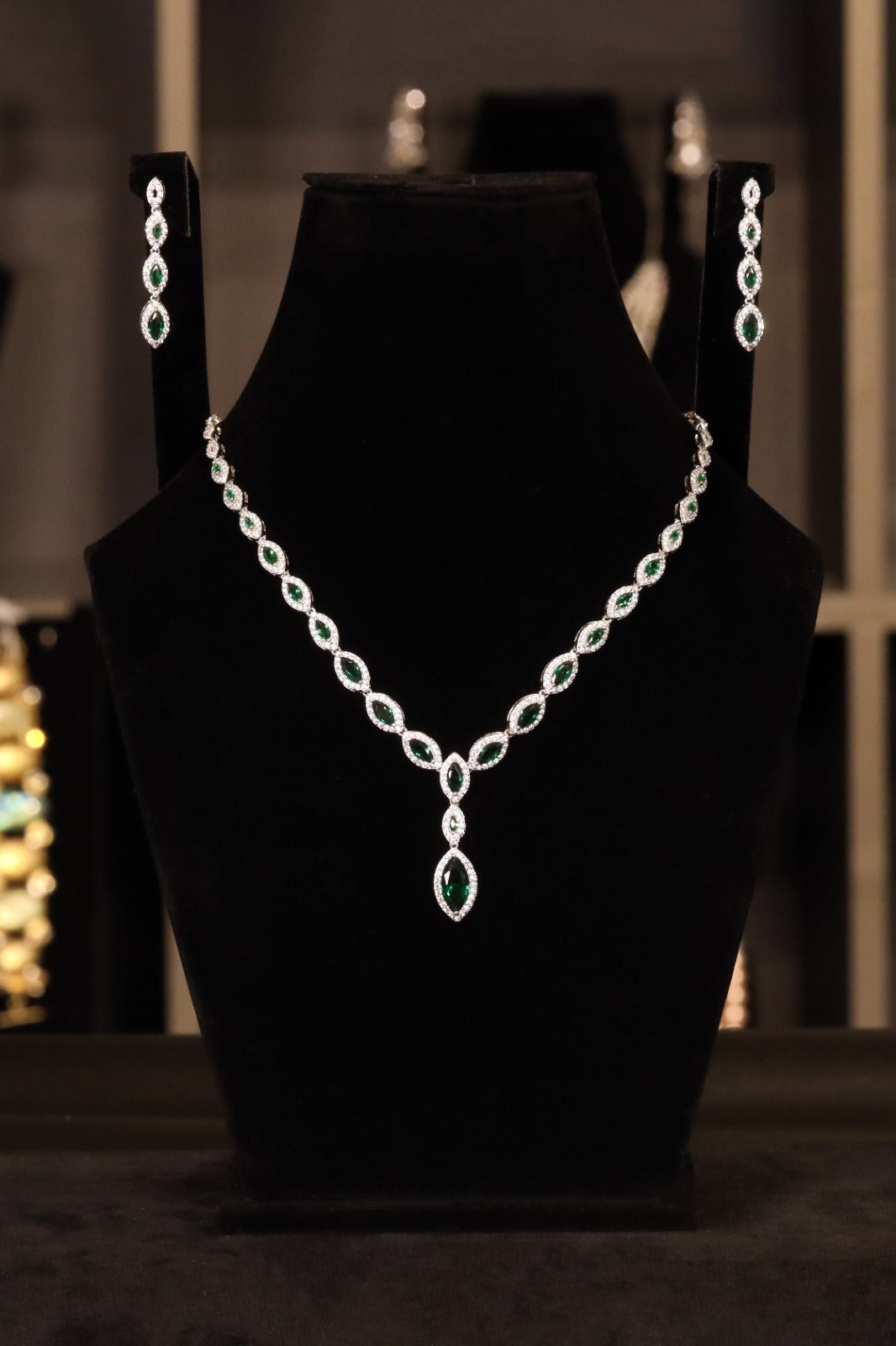 Emeralds with American zercons in Rodhium Polish
